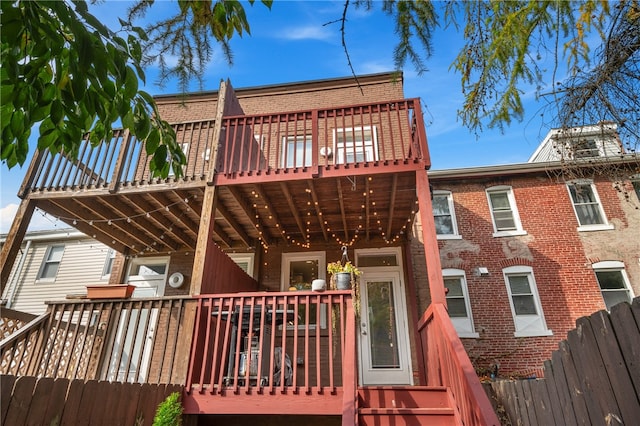 rear view of house with a wooden deck