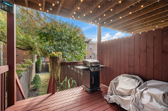 wooden terrace featuring area for grilling