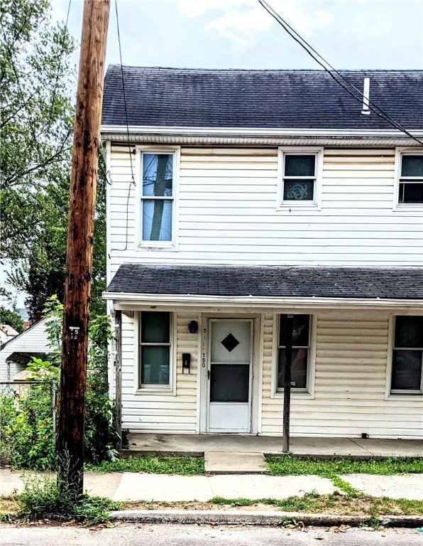 view of property featuring covered porch