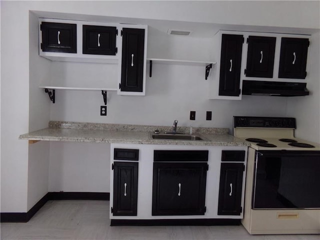 kitchen featuring sink and white range with electric cooktop