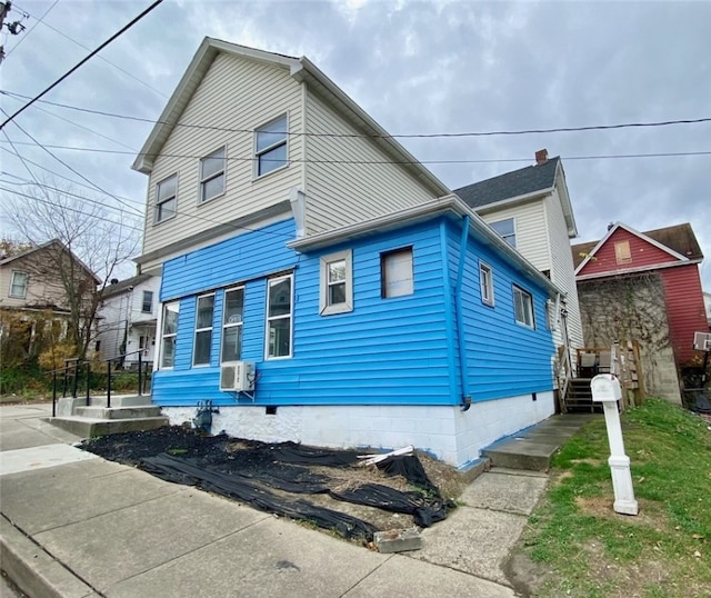 view of front of property featuring cooling unit