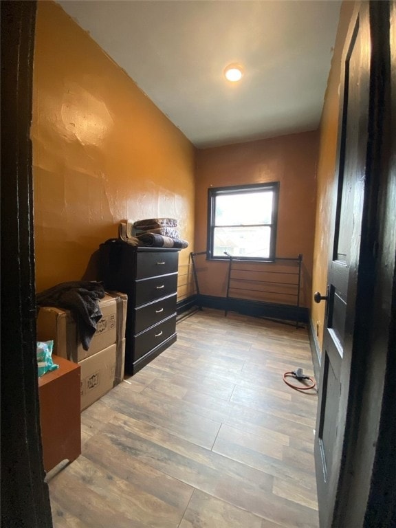 bathroom with hardwood / wood-style flooring