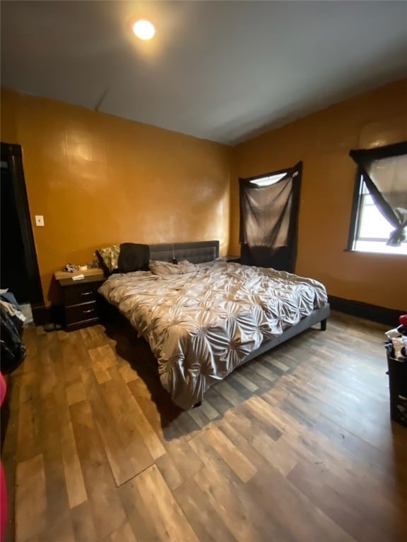 bedroom with hardwood / wood-style floors