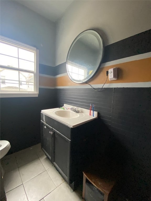 bathroom with vanity, tile patterned floors, and toilet