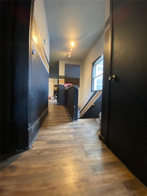 corridor featuring hardwood / wood-style flooring