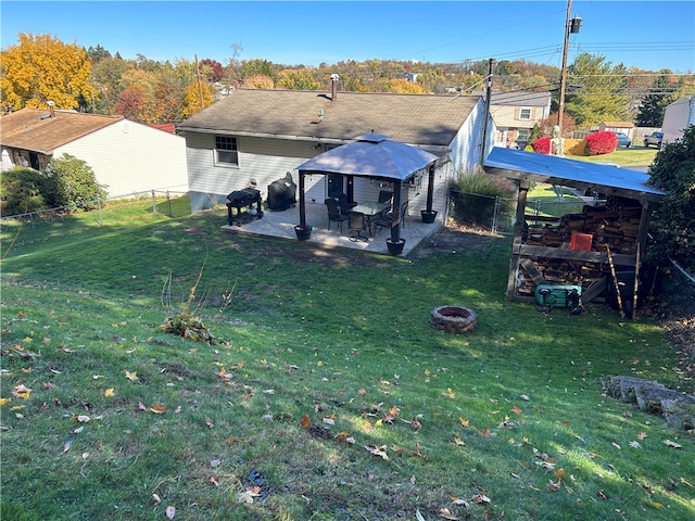 view of yard with a fire pit and a gazebo