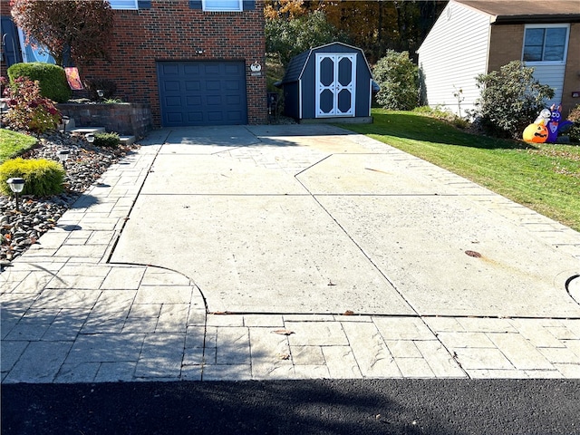 exterior space featuring a garage and a storage shed