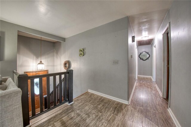 2759 Brodhead Rd, Aliquippa, PA 15001 - hallway featuring wood finished floors and an upstairs landing
