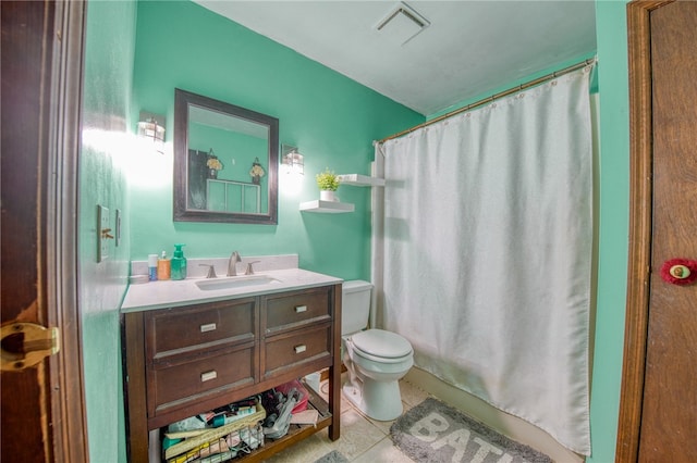 full bathroom with vanity, tile patterned flooring, toilet, and shower / tub combo