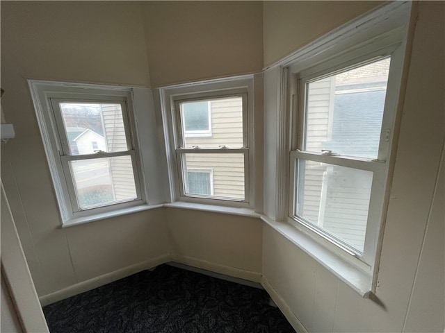 unfurnished sunroom featuring a wealth of natural light