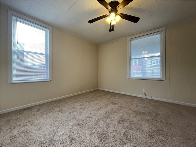 carpeted empty room with ceiling fan