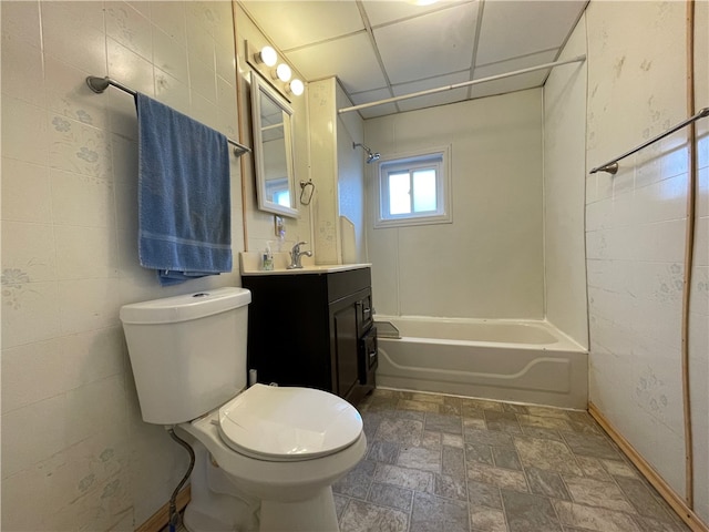 full bathroom with toilet, bathtub / shower combination, a paneled ceiling, and vanity