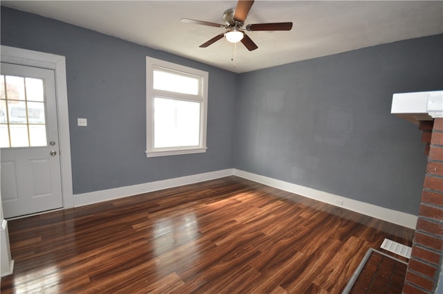 interior space with dark wood-type flooring and ceiling fan