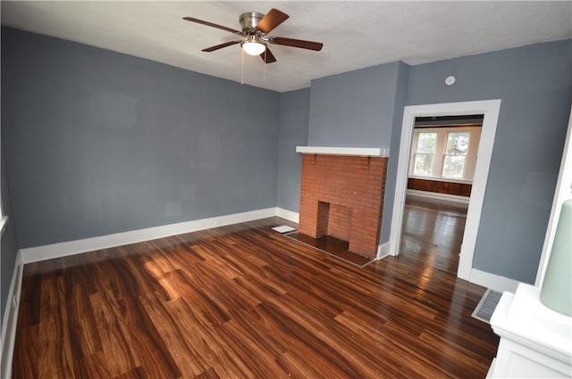 unfurnished living room with ceiling fan, dark hardwood / wood-style floors, and a fireplace