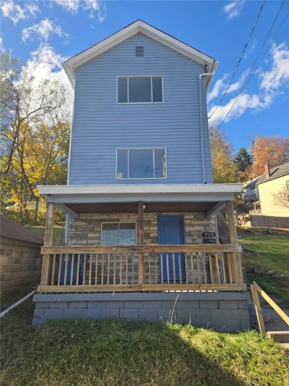 rear view of house with covered porch