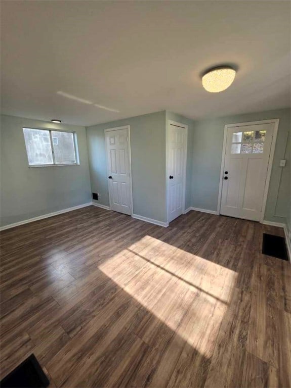 foyer entrance featuring dark hardwood / wood-style floors