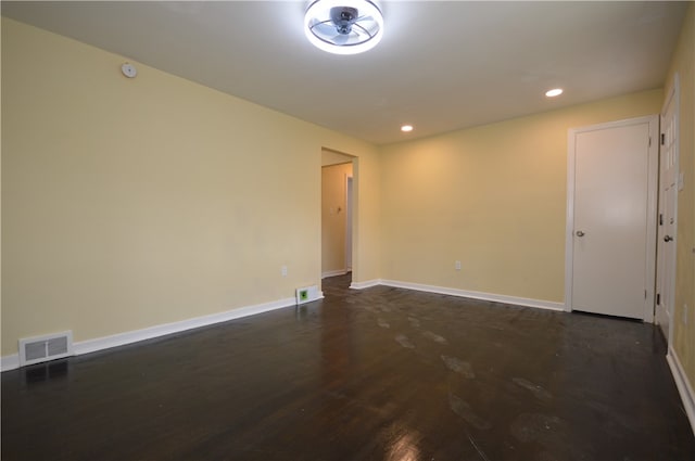 unfurnished room with dark hardwood / wood-style floors