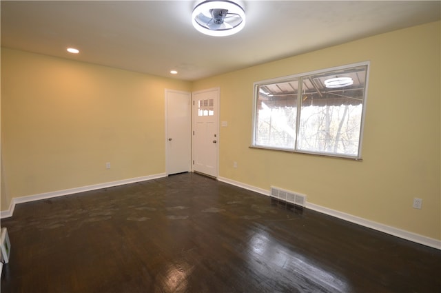 entrance foyer featuring ceiling fan and dark hardwood / wood-style floors