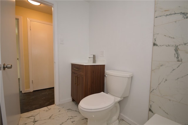 bathroom with toilet and vanity