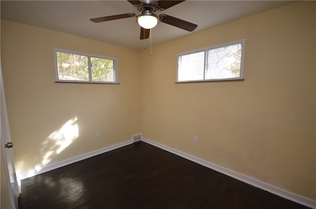 empty room featuring wood-type flooring and ceiling fan