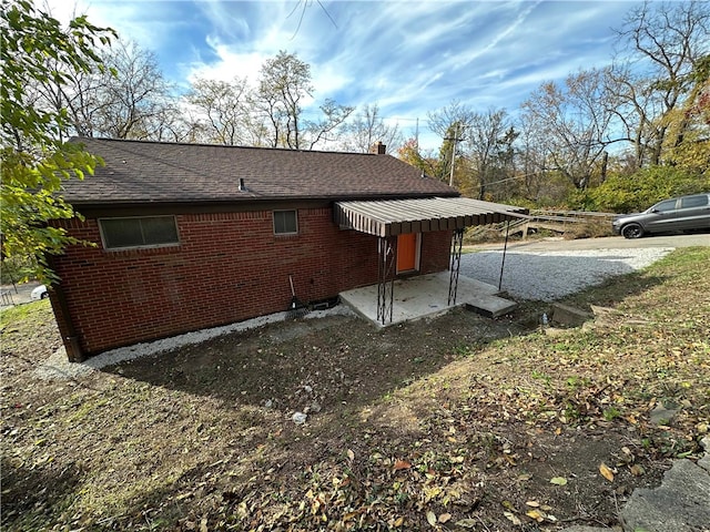 view of property exterior featuring a patio area