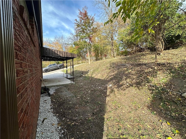 view of yard featuring a carport