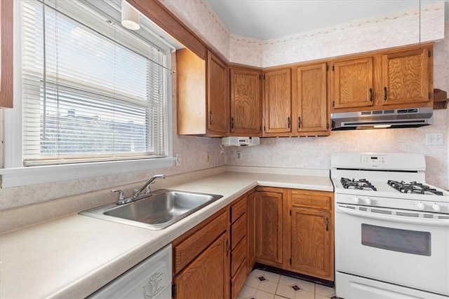 kitchen featuring white appliances and sink