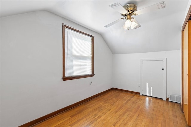 additional living space with ceiling fan, lofted ceiling, and light hardwood / wood-style floors