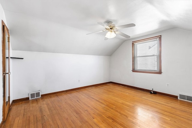 bonus room with light hardwood / wood-style floors, ceiling fan, and vaulted ceiling