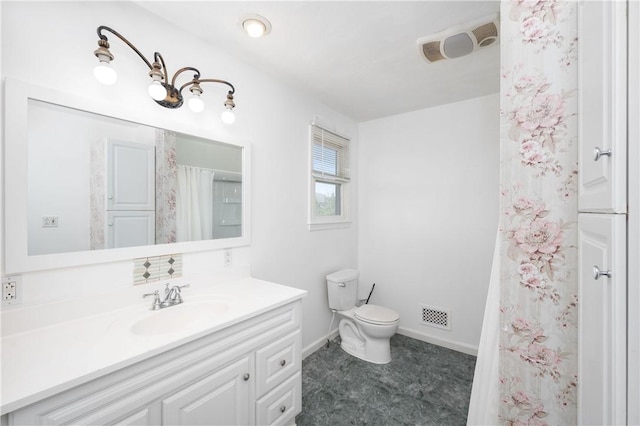 bathroom with toilet and vanity