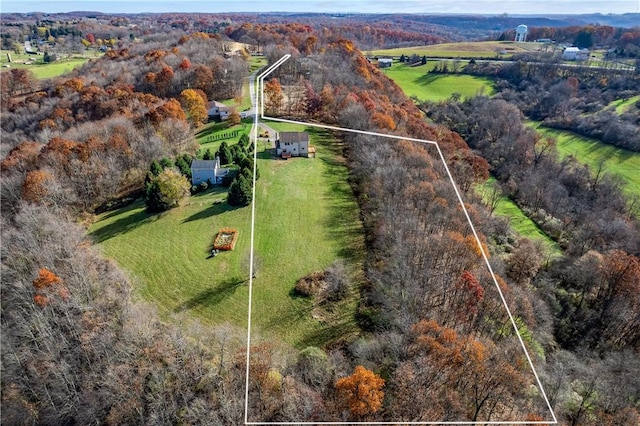 birds eye view of property with a rural view