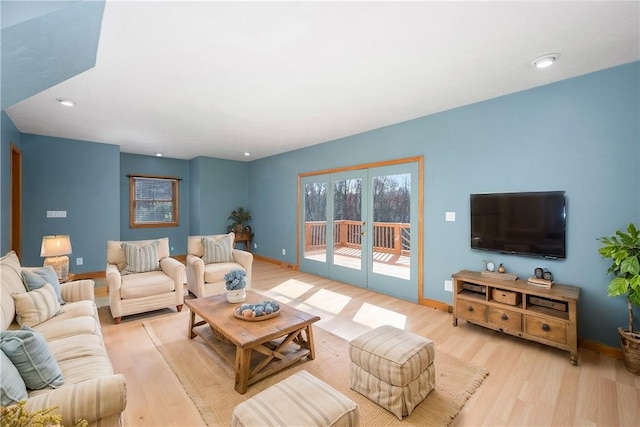 living room with light hardwood / wood-style flooring