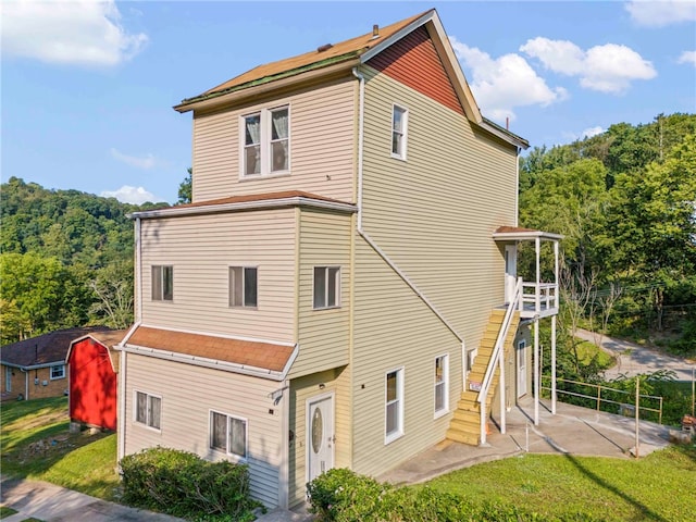 back of property with a patio