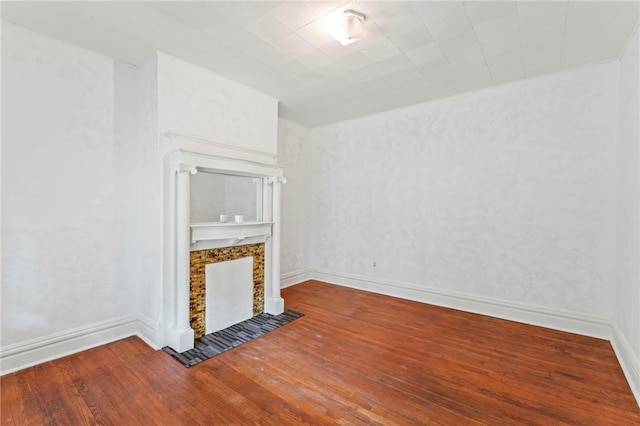 unfurnished living room with hardwood / wood-style floors