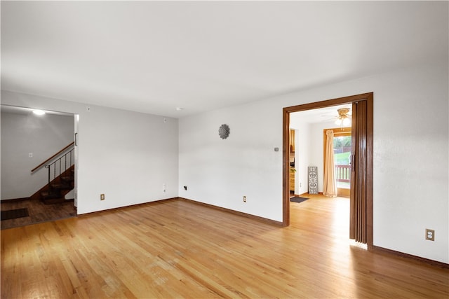 unfurnished room featuring light hardwood / wood-style flooring and ceiling fan