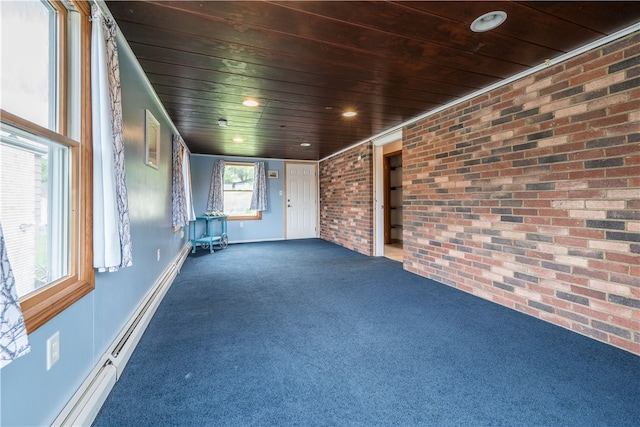 interior space featuring wooden ceiling, baseboard heating, brick wall, and dark carpet