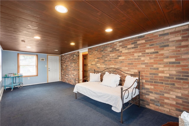 unfurnished bedroom featuring wood ceiling, dark colored carpet, and brick wall