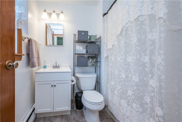 bathroom with a baseboard heating unit, toilet, vanity, and tile patterned floors