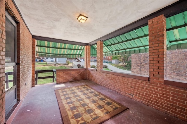 unfurnished sunroom featuring a healthy amount of sunlight