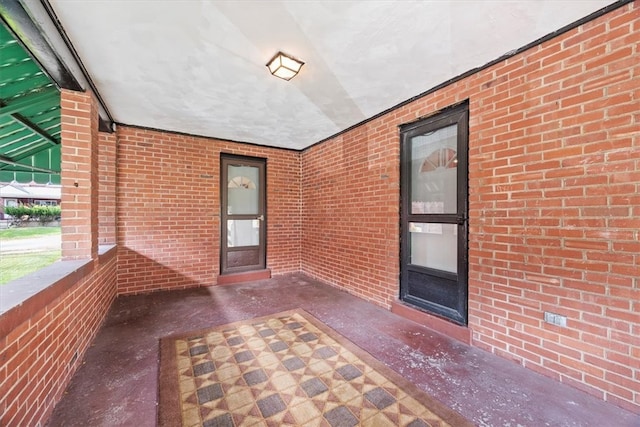 entrance to property featuring a patio