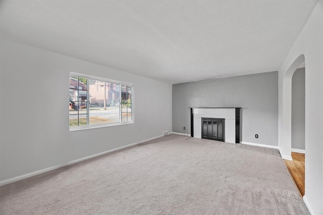 unfurnished living room with carpet flooring