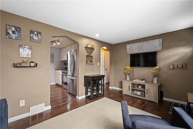 living room featuring dark hardwood / wood-style floors