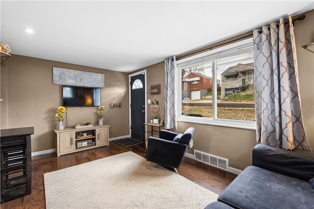 living room featuring dark hardwood / wood-style floors