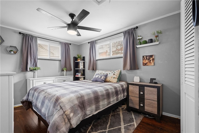 bedroom with ornamental molding, multiple windows, dark hardwood / wood-style flooring, and ceiling fan