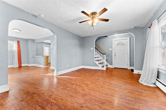 interior space featuring hardwood / wood-style flooring and ceiling fan