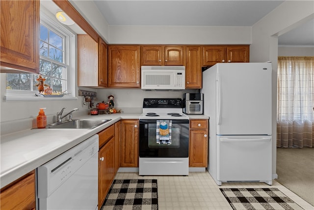 kitchen with white appliances and sink