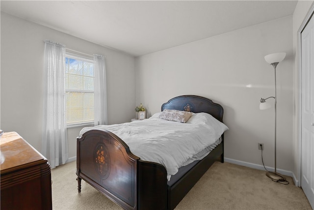 bedroom featuring light colored carpet