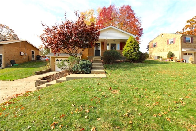 view of front of home with a garage and a front lawn