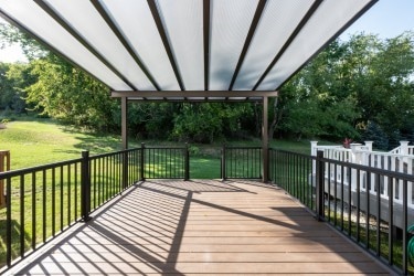 wooden deck with a yard