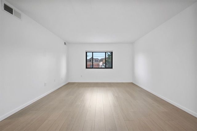 unfurnished room with light wood-type flooring